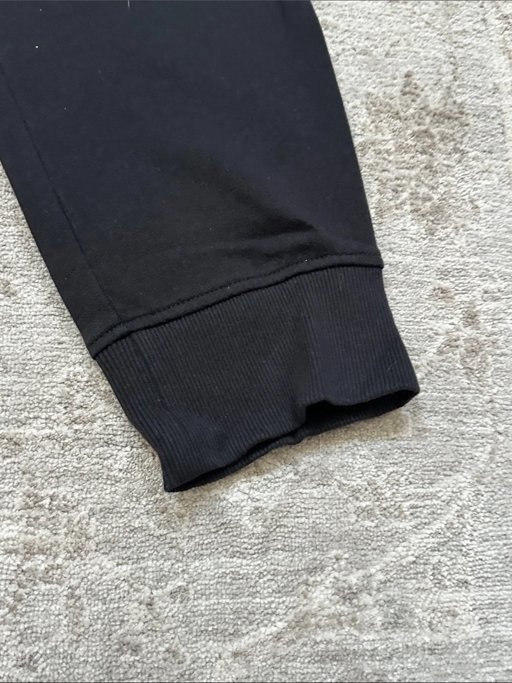 The North Face Men’s Large duo of one gray sweatpants and one black jogger.